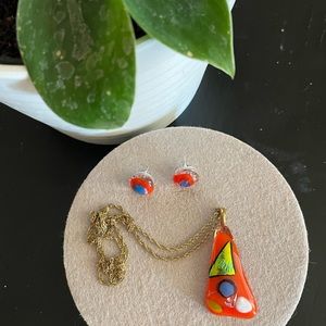 Hand crafted glass necklace and earrings on a gold tone necklace